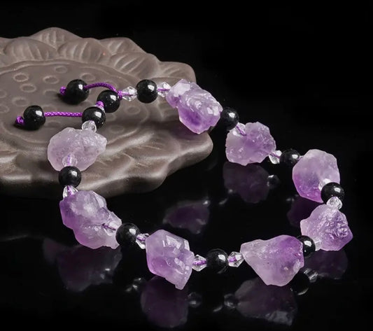Natural Amethyst Stone Bracelet. A beautifully crafted bracelet featuring genuine amethyst stones, known for their calming and healing properties. A stylish accessory that adds a touch of elegance and tranquility to your look.